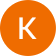 The letter k is in an orange circle on a white background.